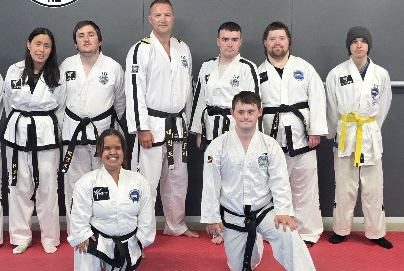 Inclusive Taekwon-Do New Zealand athletes and instructors in dobok on the mats
